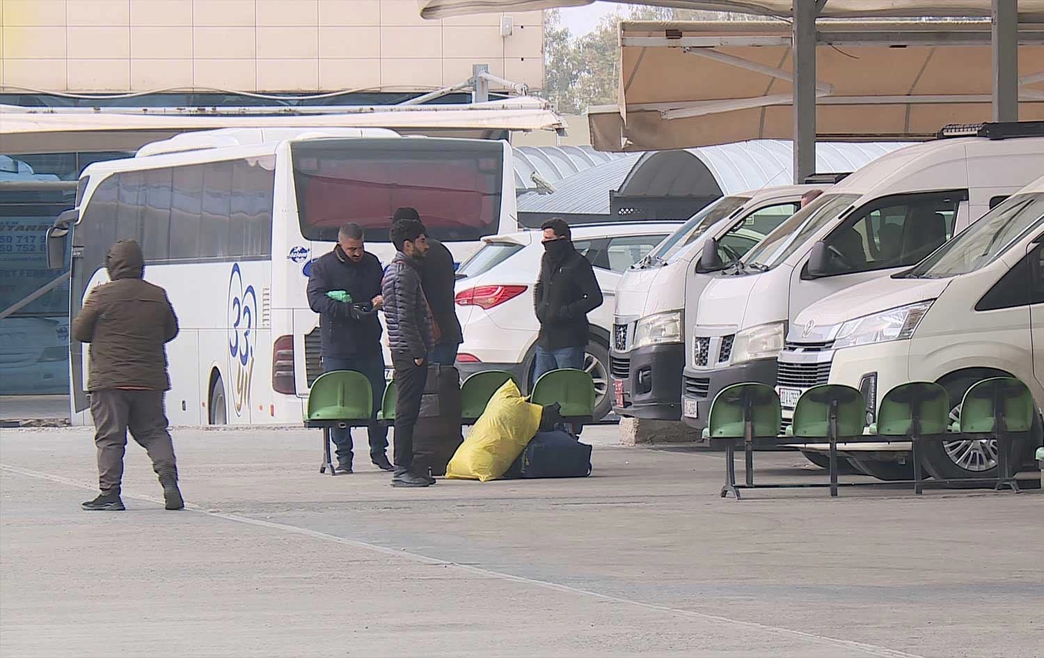 Travelers and tourists wait at Erbil’s main transport terminal on January 15, 2026. Photo: Screengrab/Rudaw