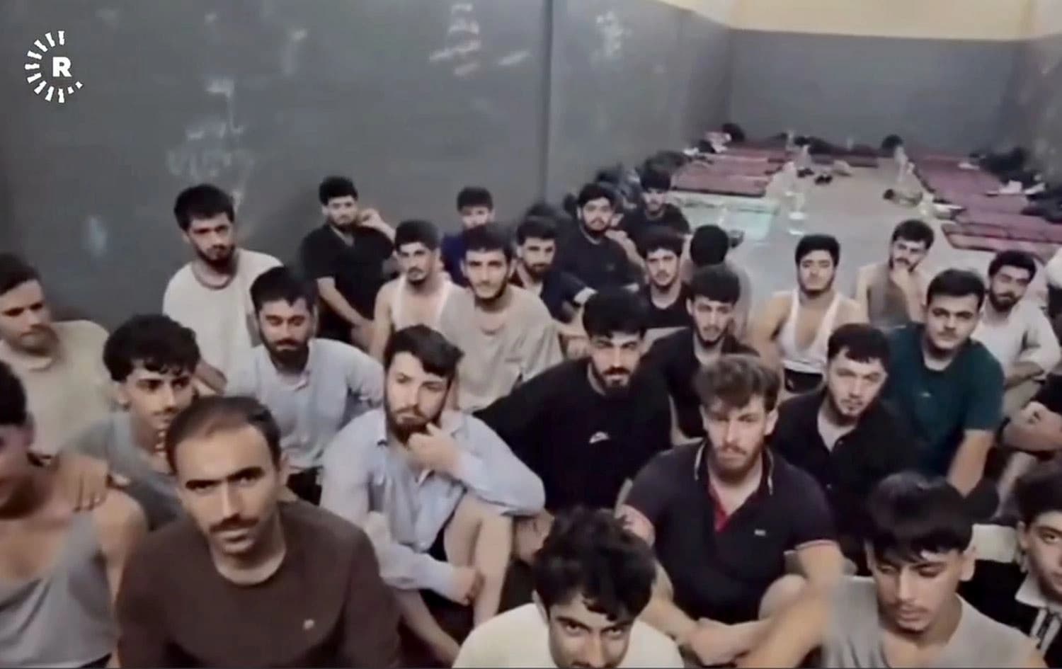 ژمارەیەک لەو گەنجە کوردانەی لە لیبیا گیریانخواردووە، وێنەکە تایبەتە بە رووداو