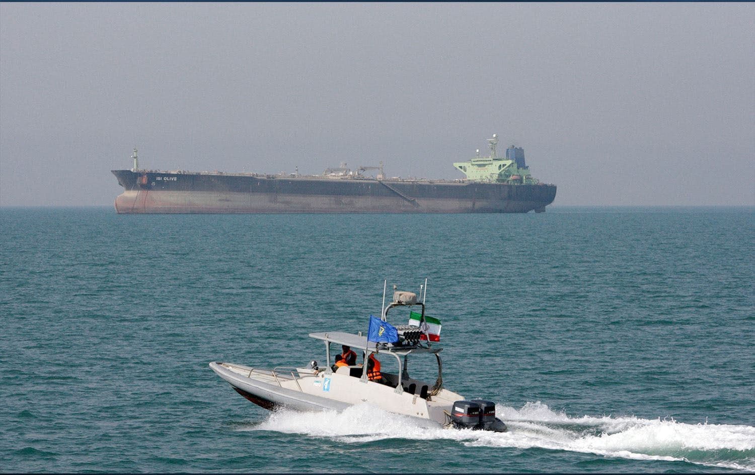 An Islamic Revolutionary Guard Corps (IRGC) speedboat moves in the Persian Gulf while an oil tanker is seen in the background. Photo: AP