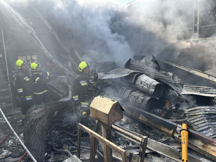 Firefighting teams on the site of a helicopter crash -  a fruit market in the city of Khomeynishahr, Isfahan province, on Tuesday, February 24, 2026. Photo: Mehr News Agency