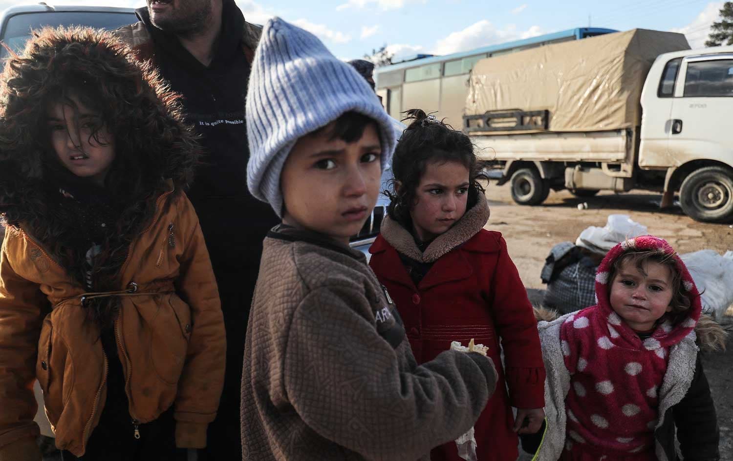 Kurdish children and their families fleeing a government advance through Kurdish-controlled areas arrive in the Kurdish Syrian city of Qamishli on January 19, 2026. File photo: AFP