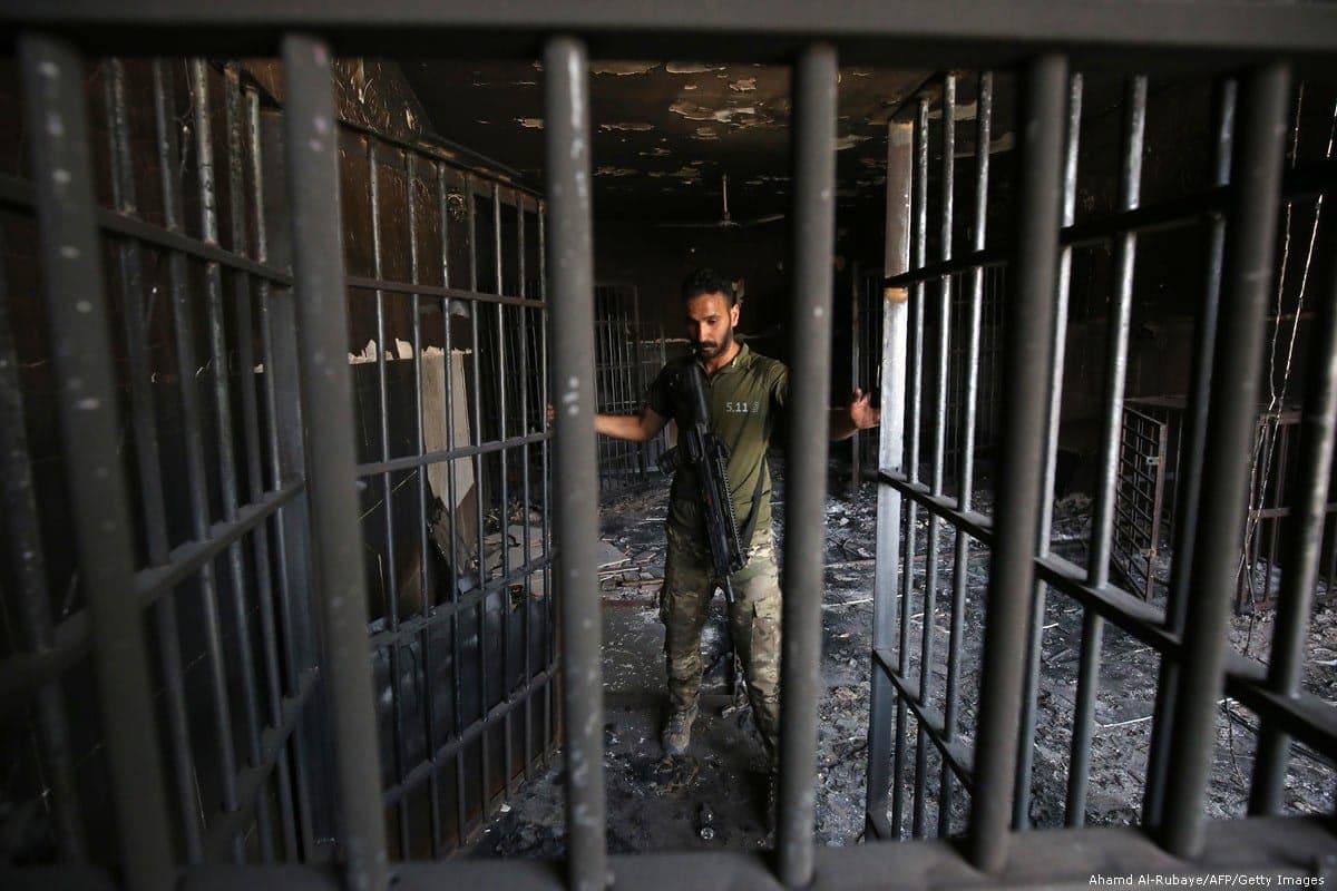 An Iraqi officer inspects a prison in Iraq in June 2016. AFP file photo