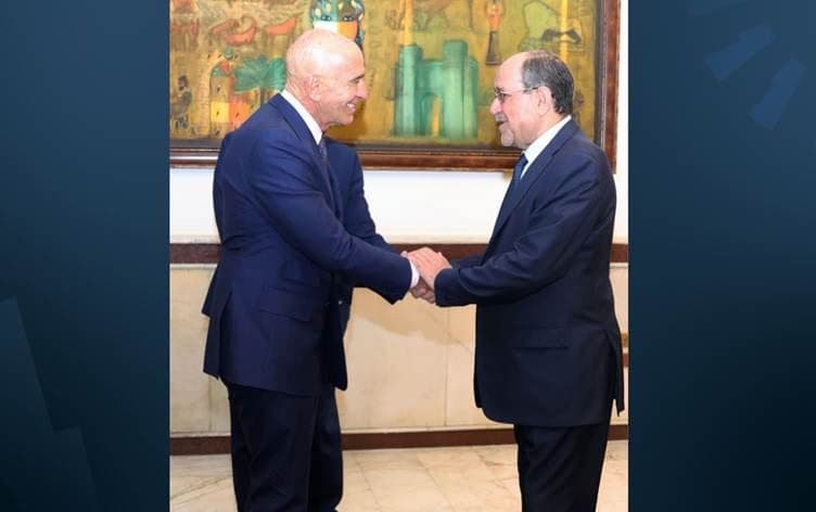 Iraqi prime ministerial candidate Nouri al-Maliki (right) shaking hands with US Ambassador to Turkey Tom Barrack in Baghdad on Friday, February 27, 2026. Photo: Maliki's media office