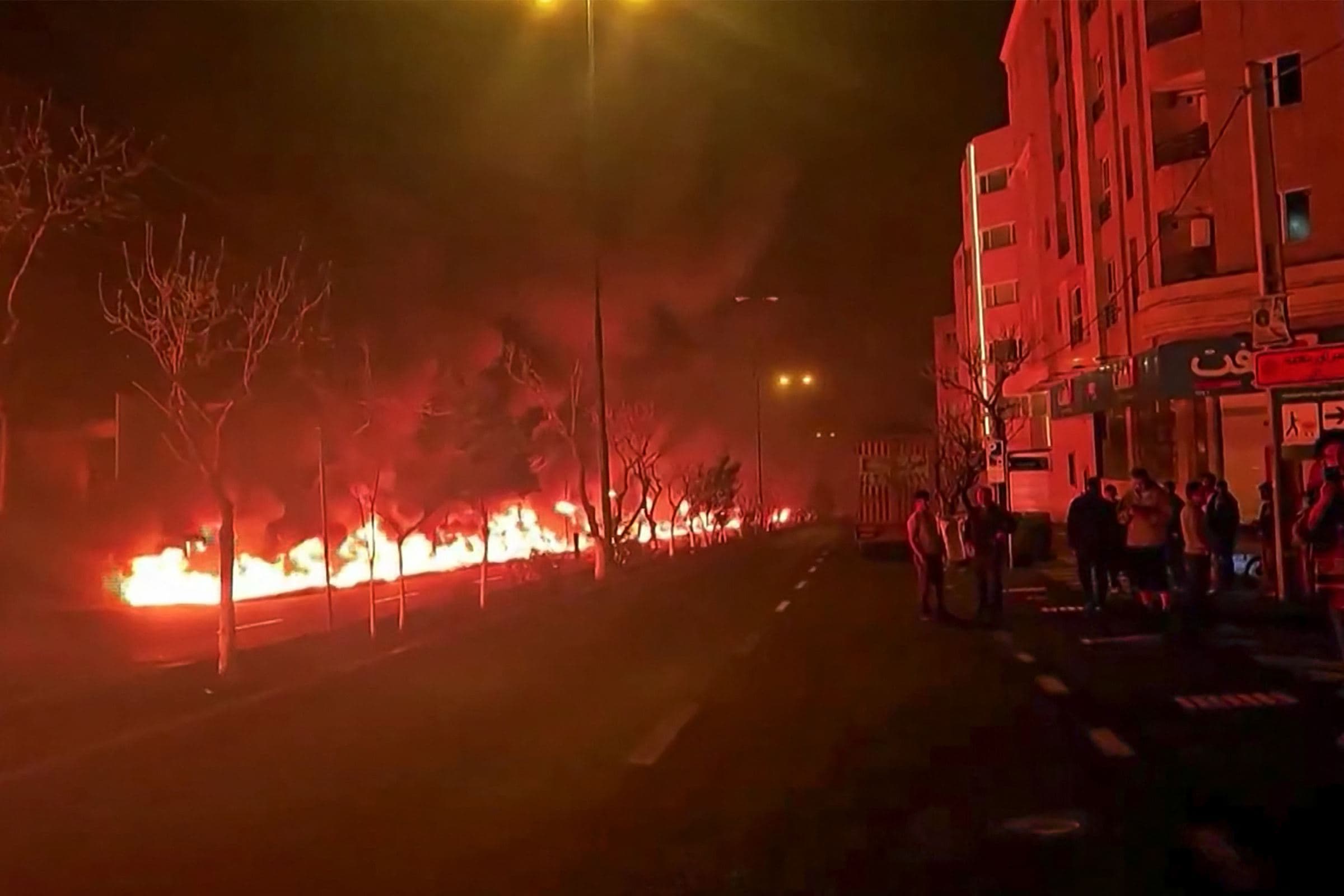 This video grab taken from UGC images posted on social media on March 7 and 8, 2026 shows fire erupting at an oil depot in Iran's capital Tehran. Photo: AFP 