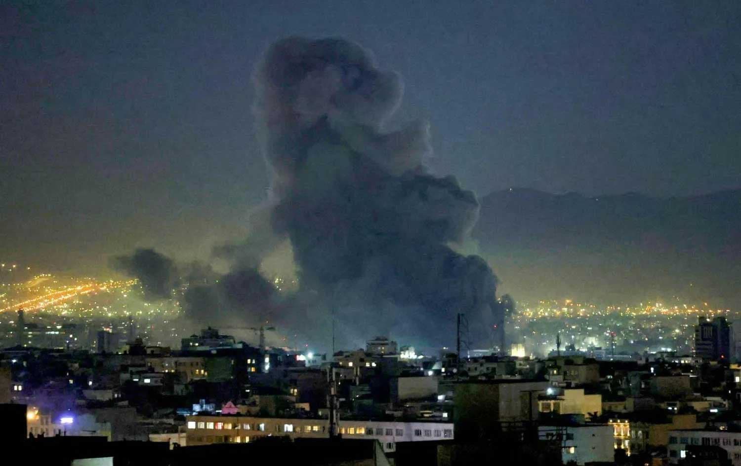 Smoke columns in the sky of the Iranian capital Tehran after a US-Israeli strike. Photo: AFP