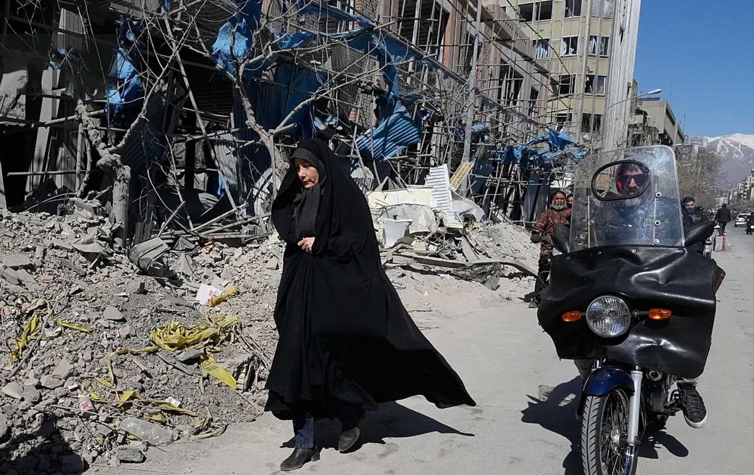 A woman walks past a building which was damaged after a strike on a police station amid the US-Israeli military campaign in Tehran, March 3, 2026. -Photo: AP
