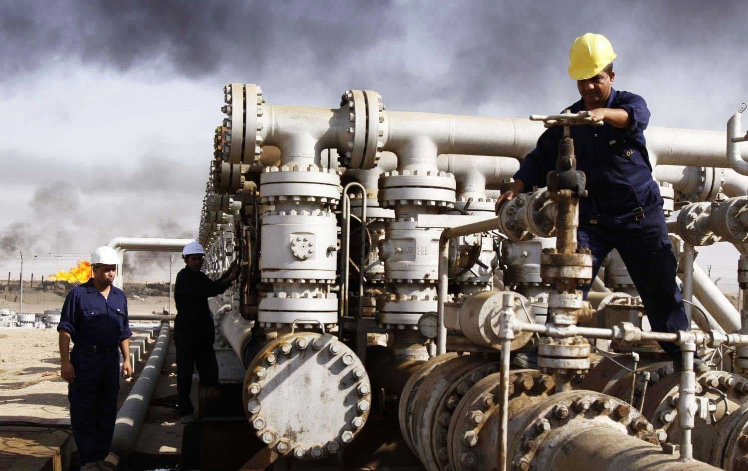 Workers at an oil refinery in Iraq. File photo: AP