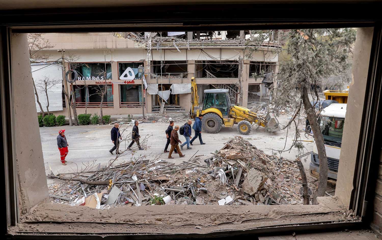 People inspect destruction at an office building that housed the offices of the Doha-headquartered news network Al Araby TV following a missile strike earlier in the day in Tehran on March 29, 2026. File Photo: AFP