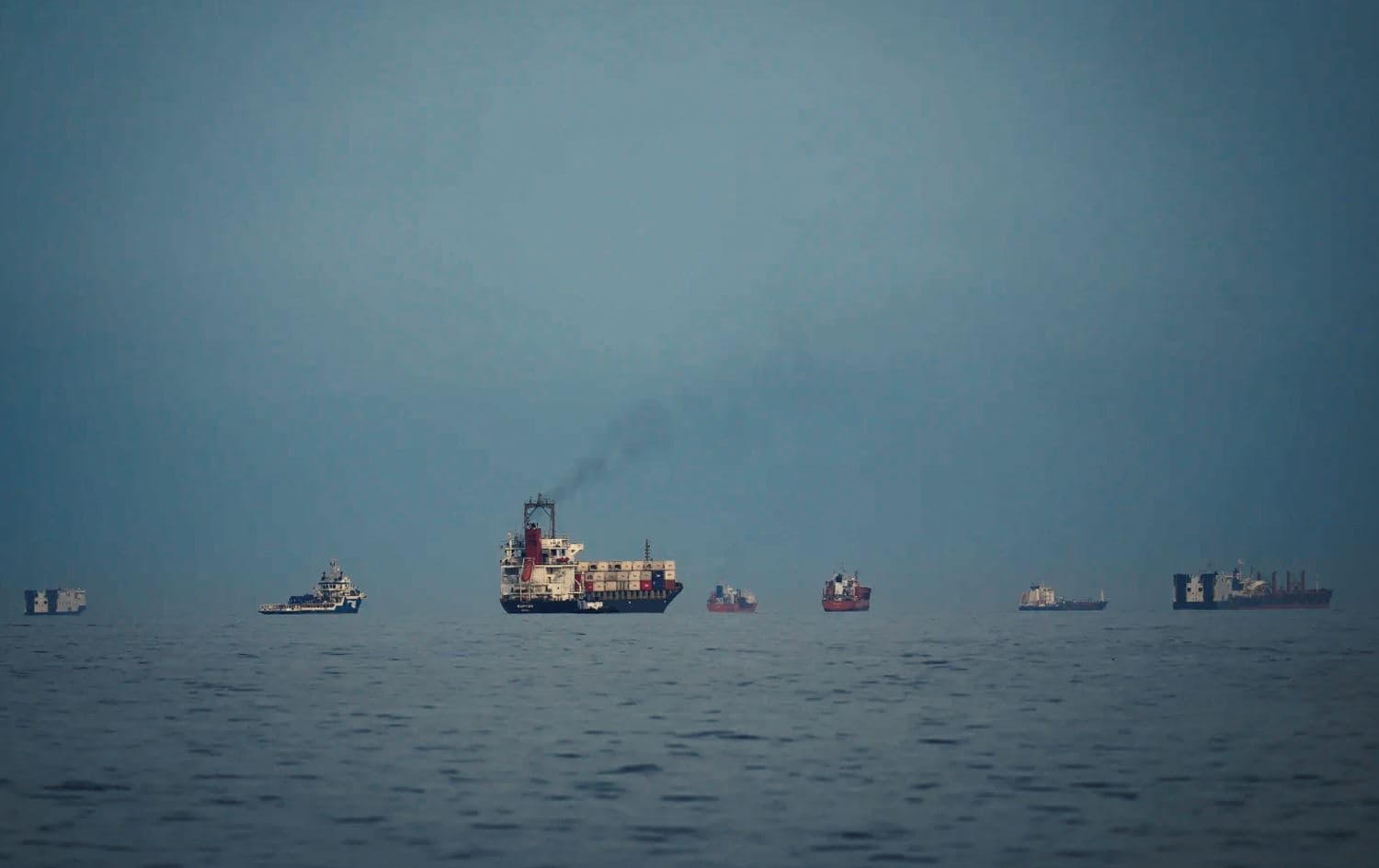 Oil tankers and cargo ships line up in the Strait of Hormuz as seen from Khor Fakkan, United Arab Emirates, Wednesday, March 11, 2026. (AP Photo)