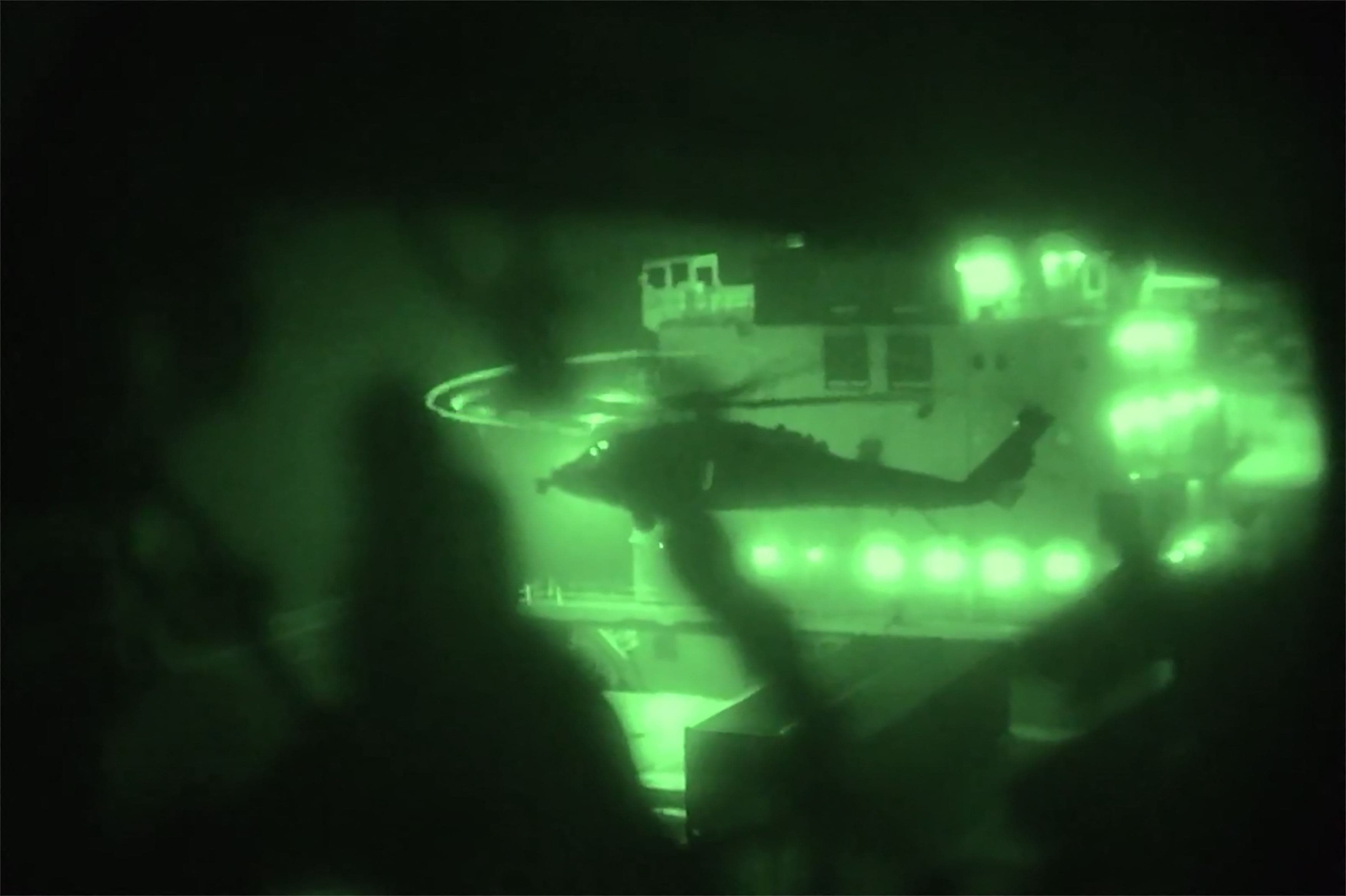 This screengrab from CENTCOM video released on April 20, 2026, shows US Marines seizing the Iranian-flagged M/V Touska in the Arabian Sea. 
