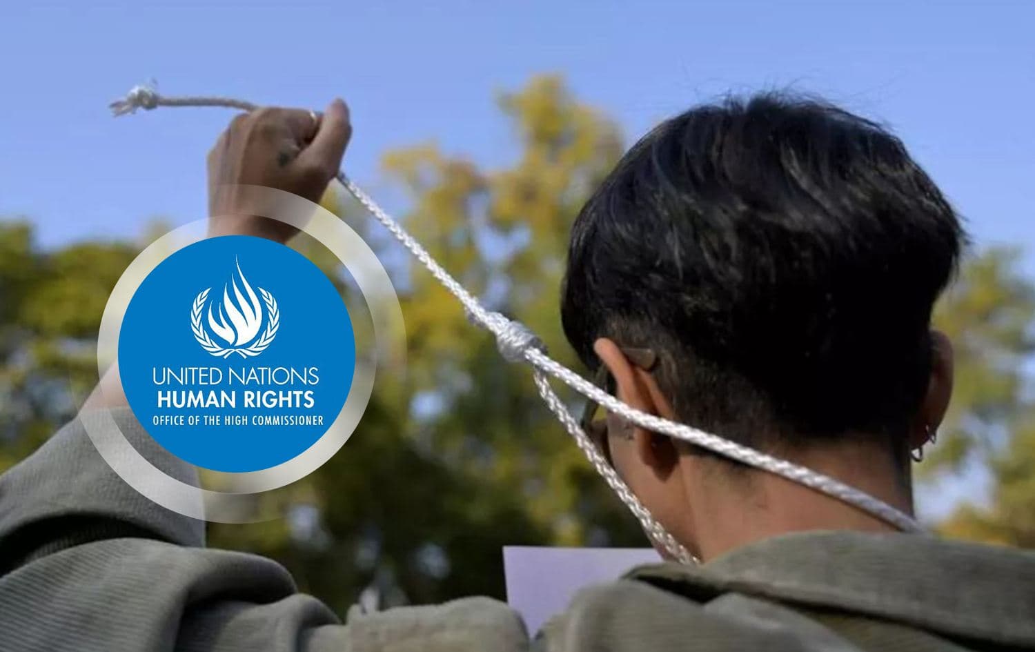 Logo of the Office of the United Nations High Commissioner for Human Rights (OHCHR) overlaid on an image from a protest in Mexico City against the execution of an Iranian footballer, December 2022. File photo: AFP.
