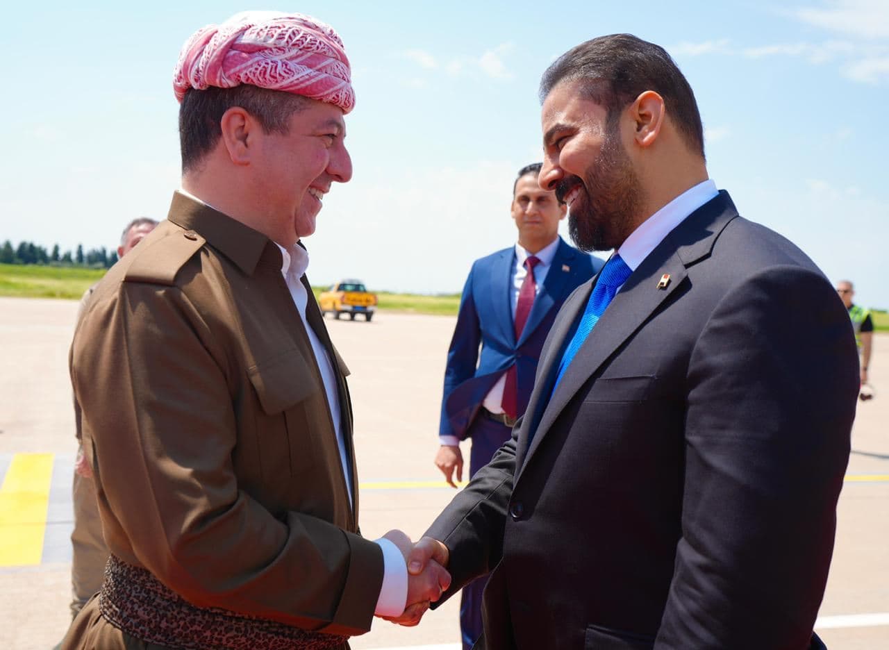 Kurdistan Region Prime Minister Masrour Barzani (left) shaking hands with Iraqi PM-designate Ali al-Zaidi upon the latter's arrival in the Erbil international airport on May 2, 2026. Photo: Iraqi PM media office