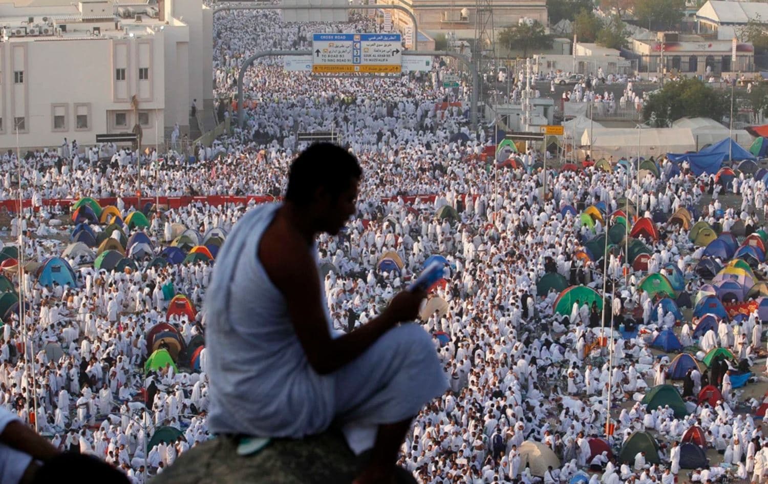 A Muslim pilgrim prays on the Mountain of Mercy on the Plain of Arafat near Mecca, Saudi Arabia. AP file photo