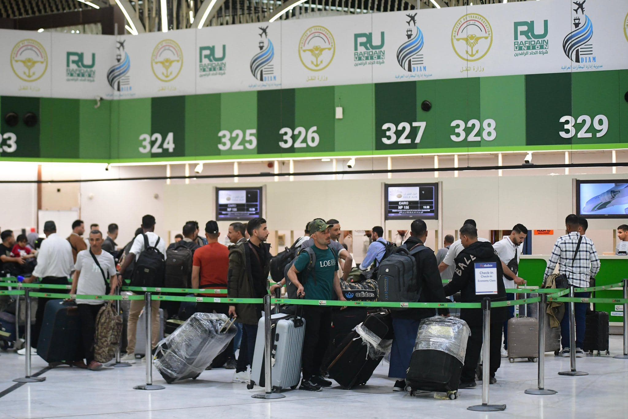 Travelers line up in front of check-in counters at Baghdad International Airport on May 8, 2026. Photo: Baghdad International Airport/Facebook