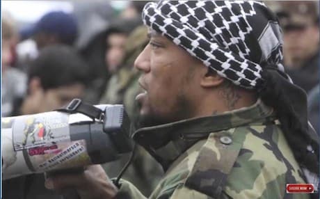 A screenshot of an ISIS video showing German rapper Deso Dogg in Syria.
