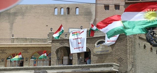 Flags of Kurdistan and a poster reading "Yes to referendum" hanging on the walls of Erbil's ancient citadel. Photo by Farzin Hassan/Rudaw