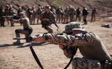 Finnish instructors demonstrate to Peshmerga soldiers how to move under enemy fire during training near Erbil. US Army file photo.