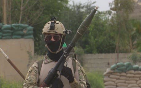 A member of the so-called Black Force, under the control of the Patriotic Union of Kurdistan (PUK) guards the state-run Iraqi North Oil Company (NOC) in Kirkuk this week. Photo: Rudaw video.