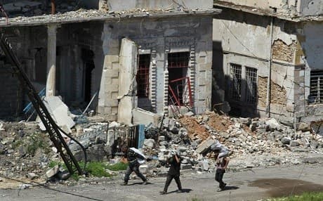 People in Mosul carry their belongings out of the war-town city. Photo: Ahmad al-Rubaye | AFP