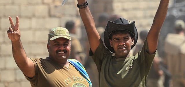 Iraqi forces flash the sign for victory as they advance towards the al-Ayadieh area north of Tal Afar on Thursday. Photo: Ahmad al-Rubaye | AFP