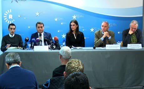 Abdulkarim Omar (2nd left), co-chair of foreign relations for the Rojava administration, Philippe Vansteenkiste (2nd right), co-founder and director of Victims-Europe, Belgium, and Professor Gerrit Loots (right) speak at a press conference in Brussels on Wednesday. Photo: Rudaw