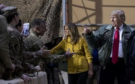 US President Donald Trump and first lady Melania greet members of the military as they arrive at Al-Asad Base. Photo: Andrew Harnik/AP