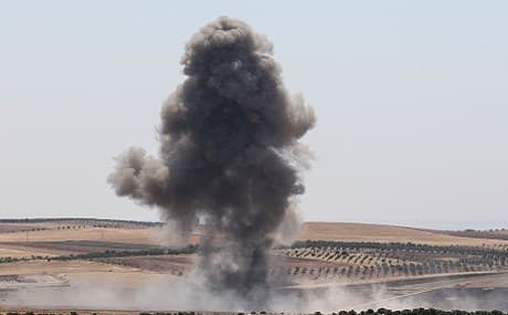 Smoke billows after reported regime air strikes near Khan Sheikhun in Syria's Idlib province, July 11, 2019. Photo: Anas al-Dyab / AFP