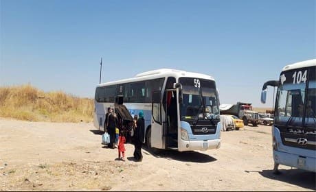 IDPs board a bus to return to their home areas across Nineveh province in July 2019. Photo: Ministry of Migration and Displacement social media