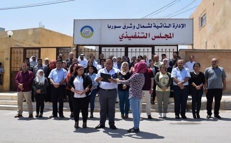 Autonomous Administration of North and East Syria (NES) co-chair Abd Hamid al-Muhashash reads out an August 5 statement outside the Executive Council in Ain Issa, Syria. Photo: ANHA