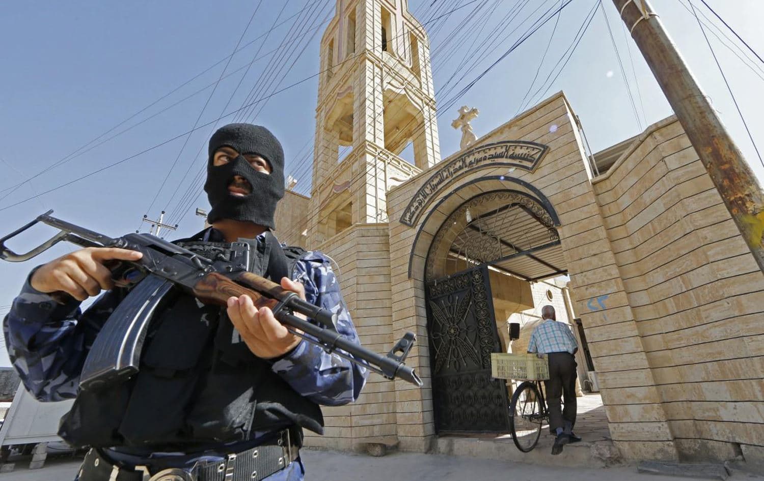An Iraqi security officer stands guard outside the Church of the Virgin Mary in the northern town of Bartala, Nineveh, June 15, 2012. File photo: Karim Sahib / AFP