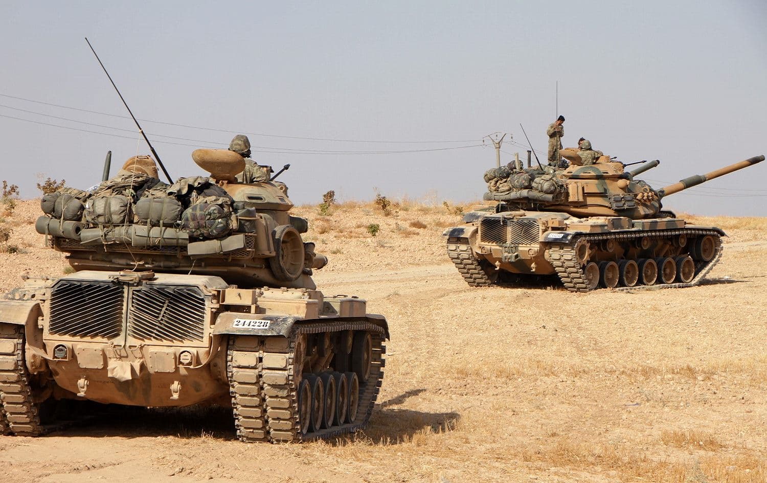 Turkish soldiers drive American-made M60 tanks in the town of Tukhar, north of Syria's northern city of Manbij, October 14, 2019. Photo: Aref Tammawi / AFP