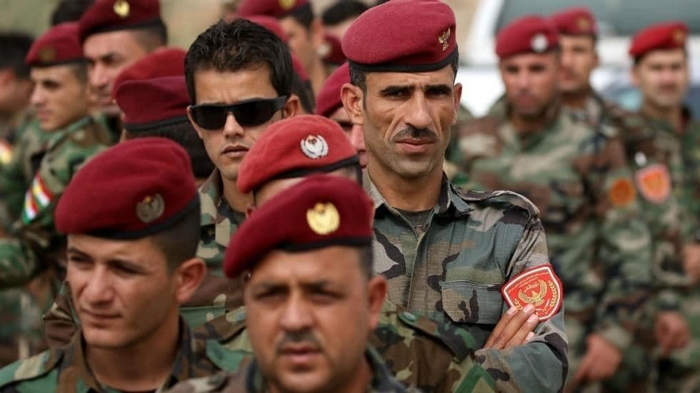 Members of a Kurdish Peshmerga battalion queue up outside a polling station in Erbil as they wait to cast their vote in the Kurdish independence referendum, September 25, 2017. Photo: Safin Hamed / AFP