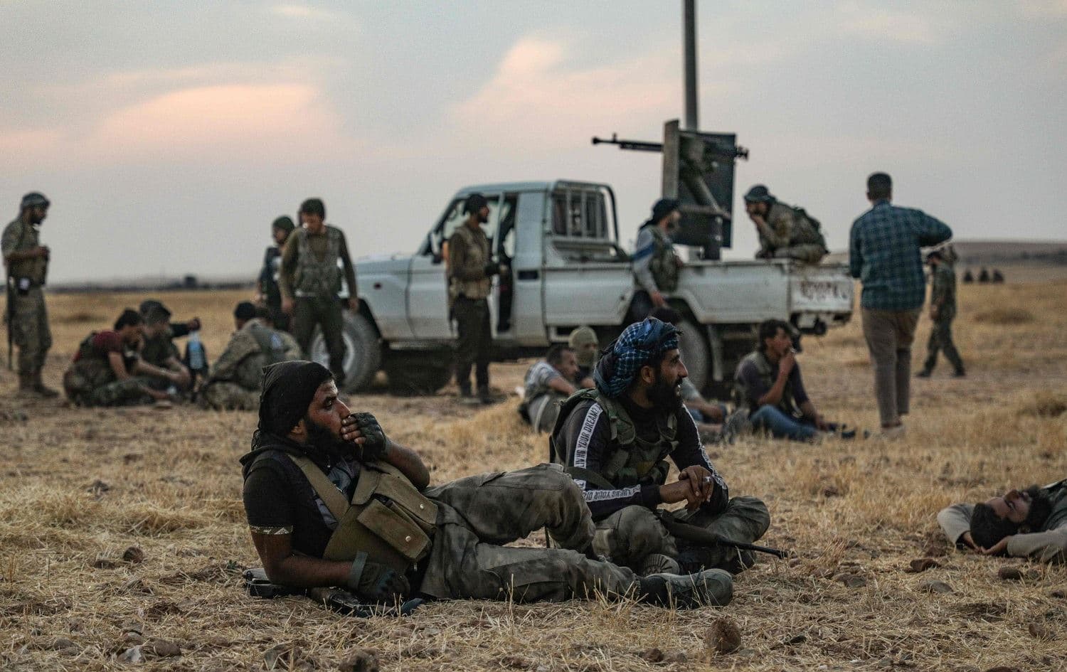 Turkey-backed Syrian fighters gather on the northern outskirts of the Syrian city of Manbij near the Turkish border on October 14, 2019. Photo: AFP / Zein al-Rifai
