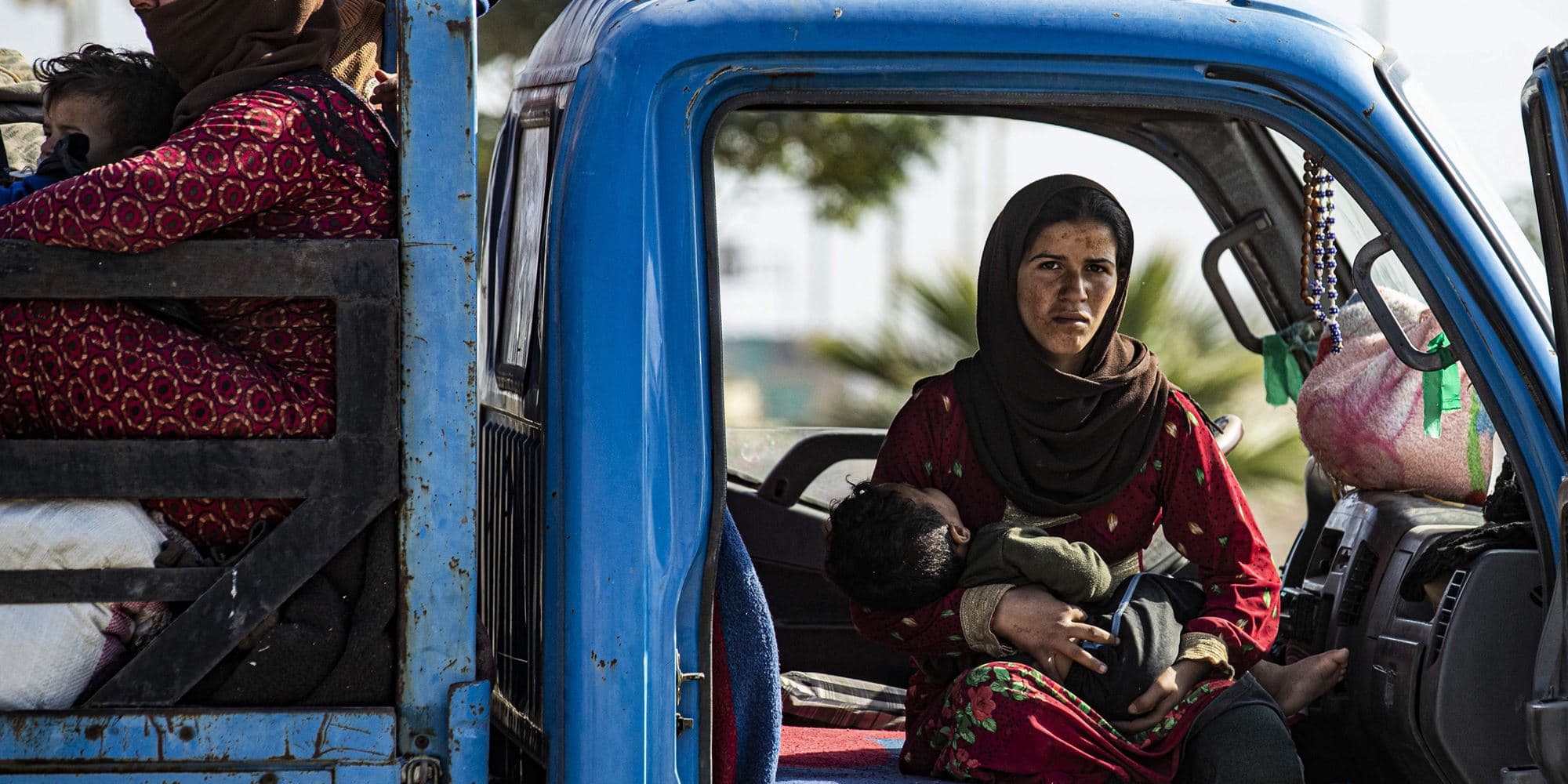 Syrian families fleeing the battle zone between Turkey-led forces and Kurdish fighters from the Syrian Democratic Forces (SDF) on the outskirts of Hasakeh on October 15, 2019. Photo:Delil Souleiman/AFP