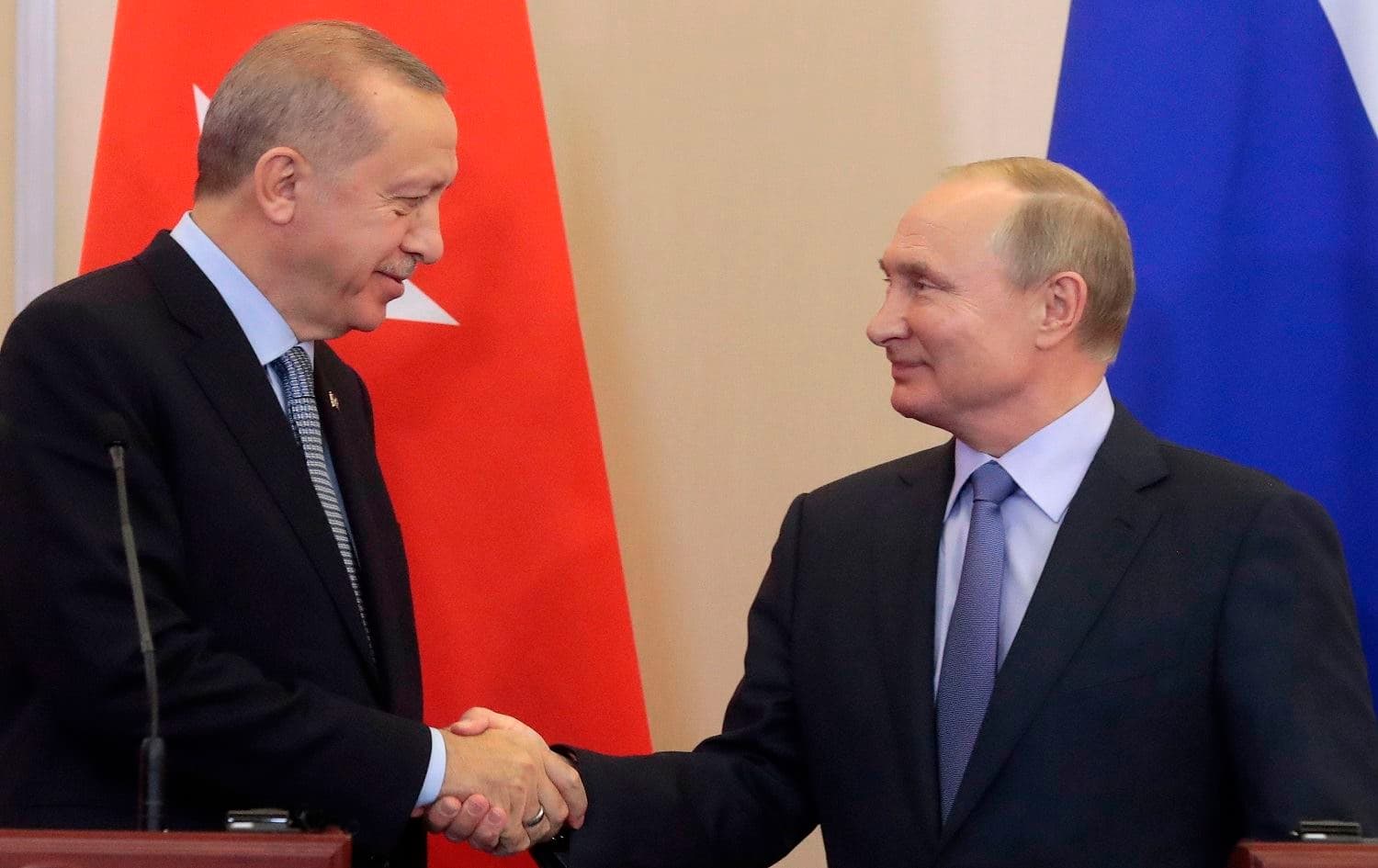 Russian President Vladimir Putin and his Turkish counterpart Recep Tayyip Erdogan shake hands during a joint press conference following their talks in the Black sea resort of Sochi on October 22, 2019. Photo: Sergei Chirikov/AFP/POOL