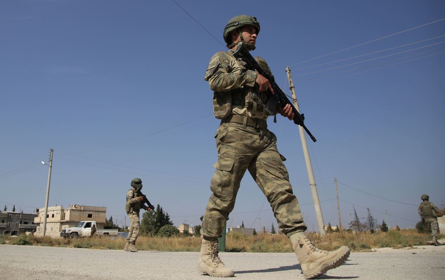 Turkish soldiers patrol the northern Syrian Kurdish town of Gire Spi (Tal Abyad), on the border between Syria and Turkey, on October 23, 2019. Photo: Bakr Alkasem