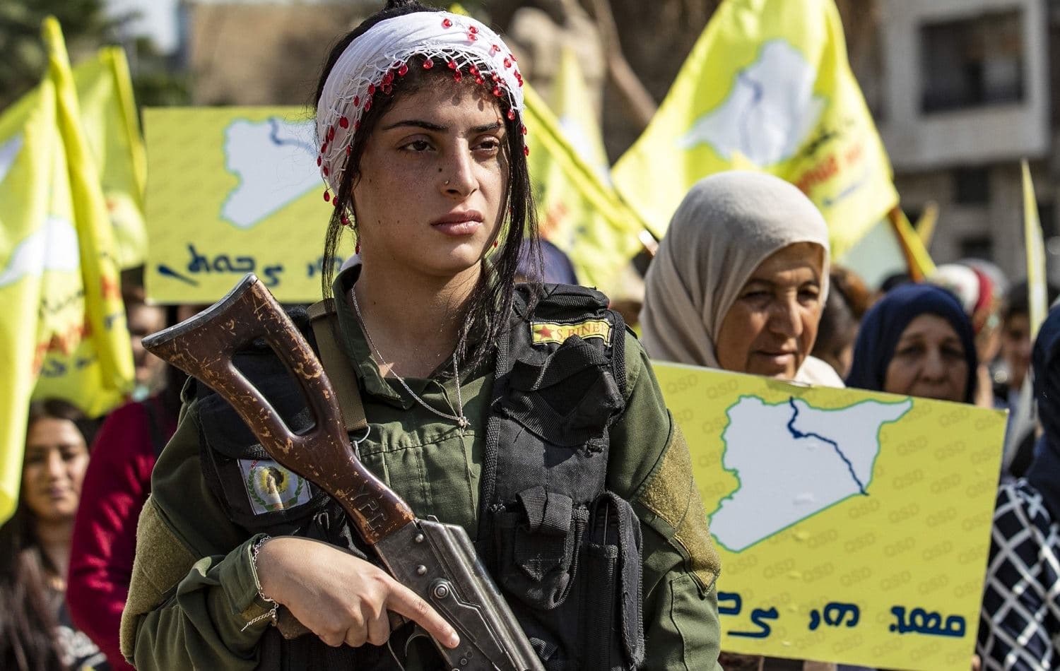 A member of the Kurdish internal security services (Asayesh) stands guard during a demonstration by Syrian Kurds against the Turkish assault on northeastern Syria in Qamishli on October 28, 2019. Photo: Delil Souleiman/AFP
