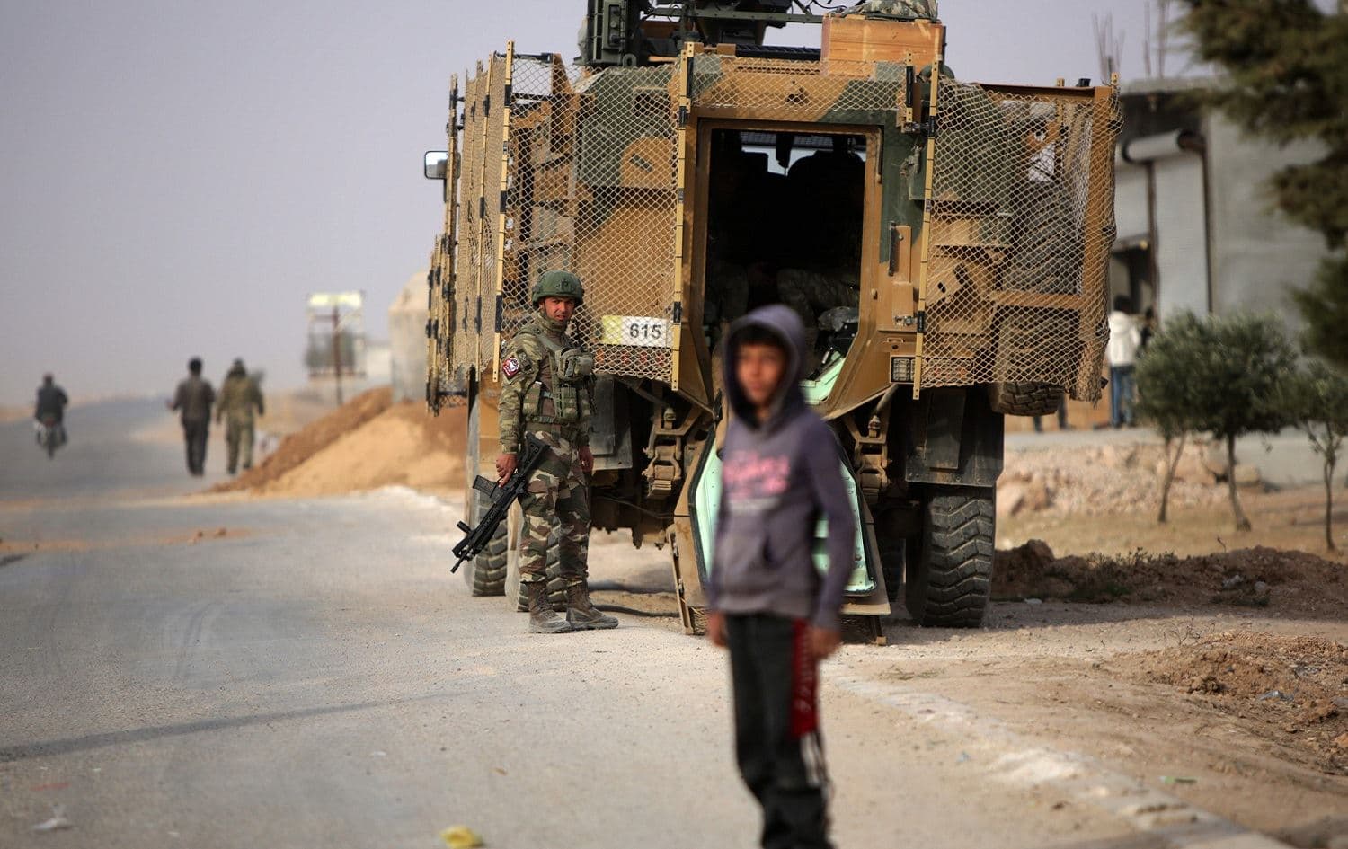 A Turkish soldier stands near his armored vehicle outside the north Syrian town of Ain Issa, November 26, 2019. Photo: Bakr al-Kasem / AFP