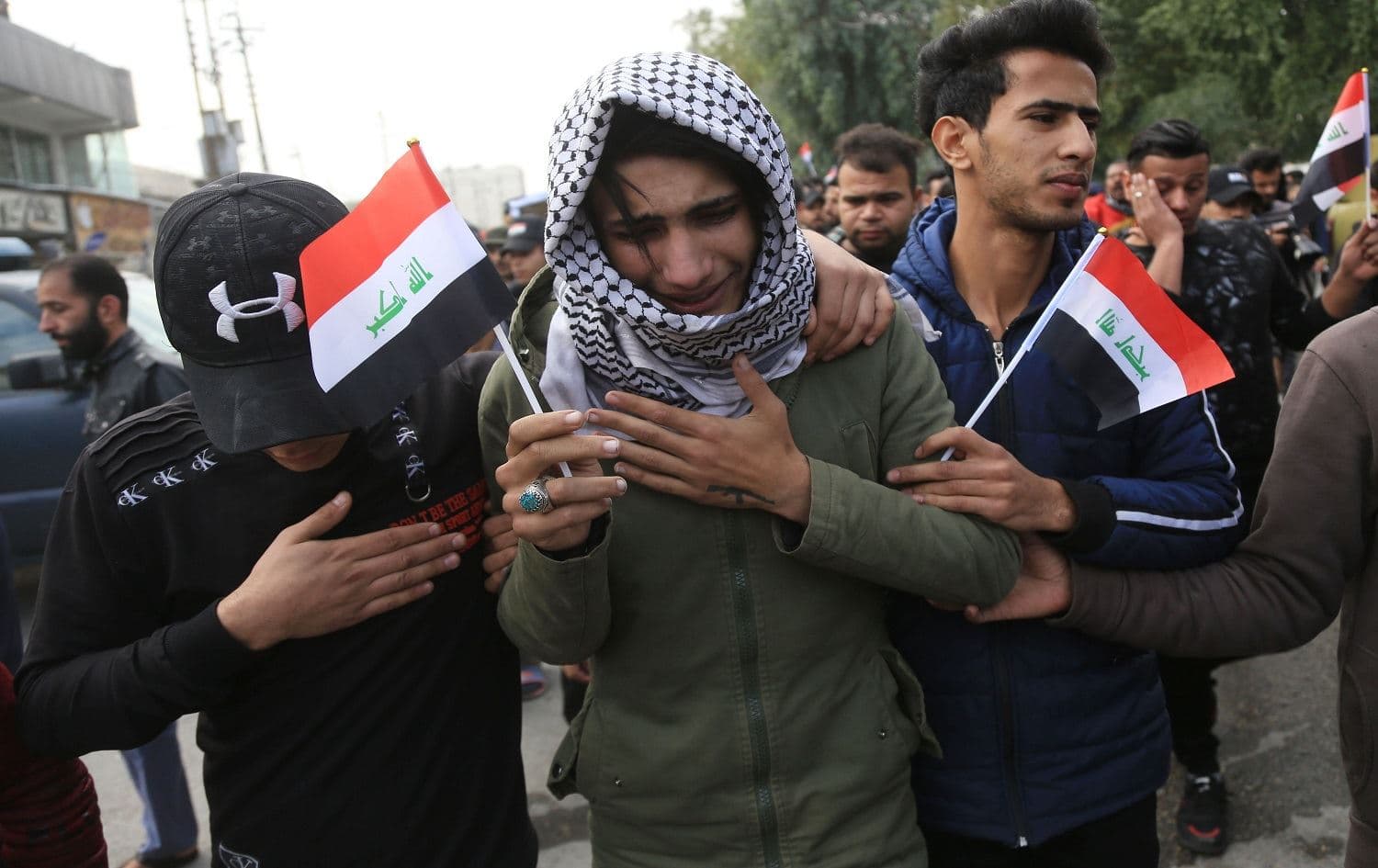 Mourners at the funeral procession of a prominent civil society activist in Karbala on December 9, 2019. Photo: Mohammed Sawaf/AFP