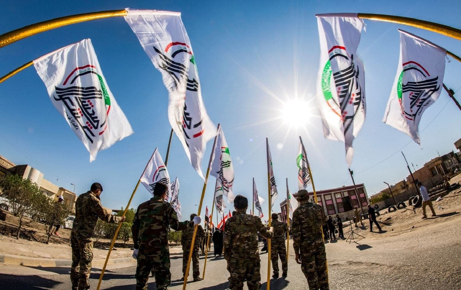 Members of Iraq’s Popular Mobilization Forces, also known as Hashd al-Shaabi, march with the group's flags during a parade marking al-Quds (Jerusalem) International Day in the southern Iraqi city of Basra, May 31, 2019. File photo: Hussein Faleh / AFP