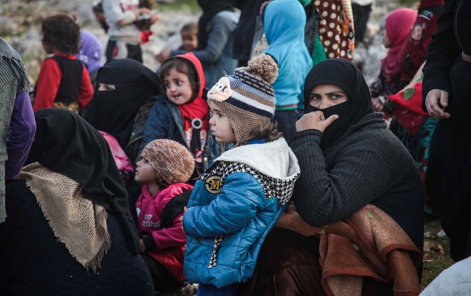 Displaced Syrians from the south of Idlib province queue to receive food aid from a truck in the countryside west of the town of Dana on December 23, 2019. Photo: Aaref Watad/AFP