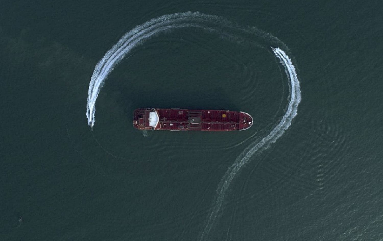 Speedboats from Iran's Revolutionary Guard circle the British-flagged oil tanker Stena Impero on Sunday, July 21, 2019 in the Iranian port of Bandar Abbas. Photo via AP/Morteza Akhoondi/Tasnim News Agency