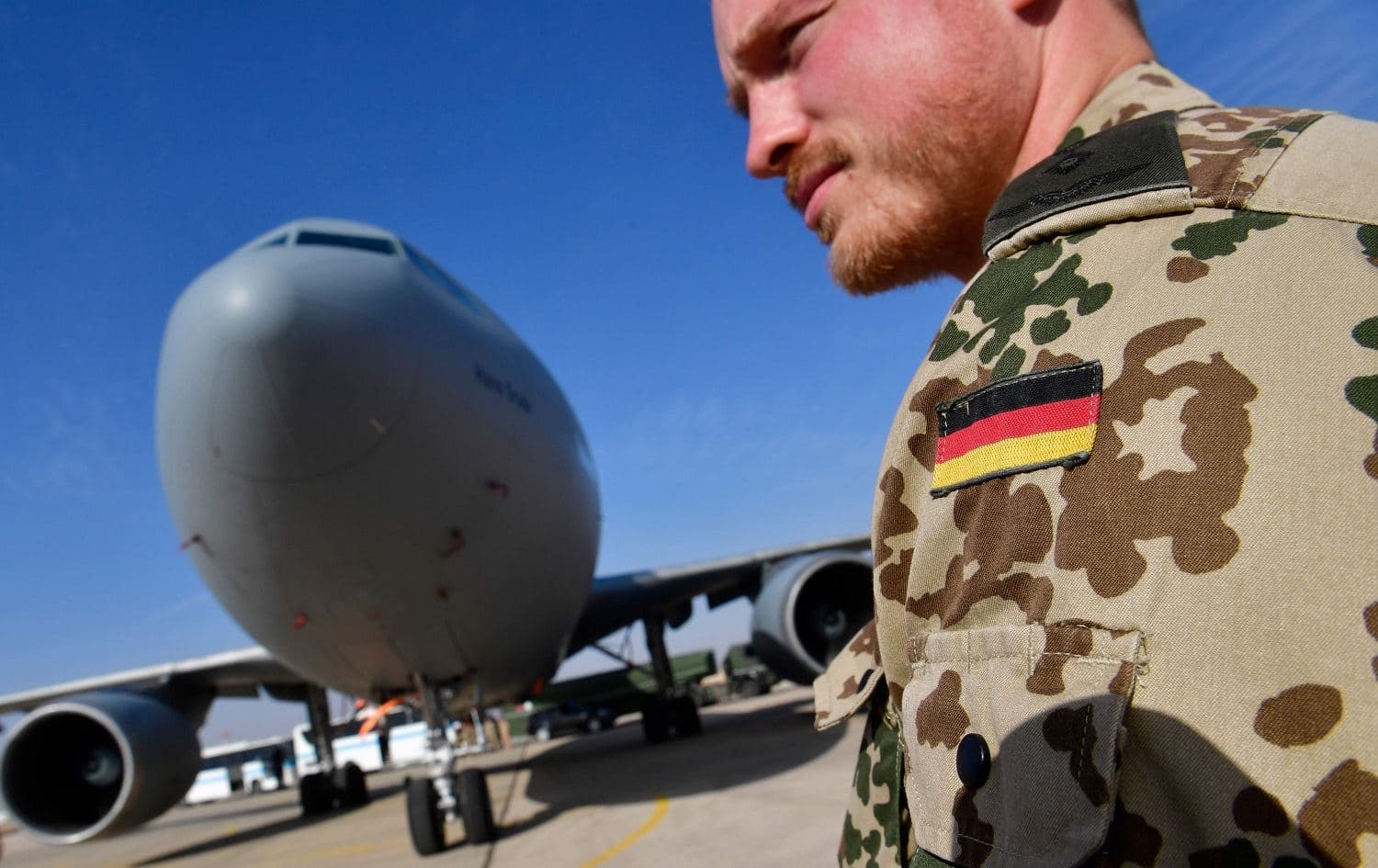 A member of the German contingent stands next to a German air force Airbus A-310 aerial refueling tanker aircraft at the Al Azraq air base in Jordan on January 13, 2018. File photo: John MacDougall / AFP