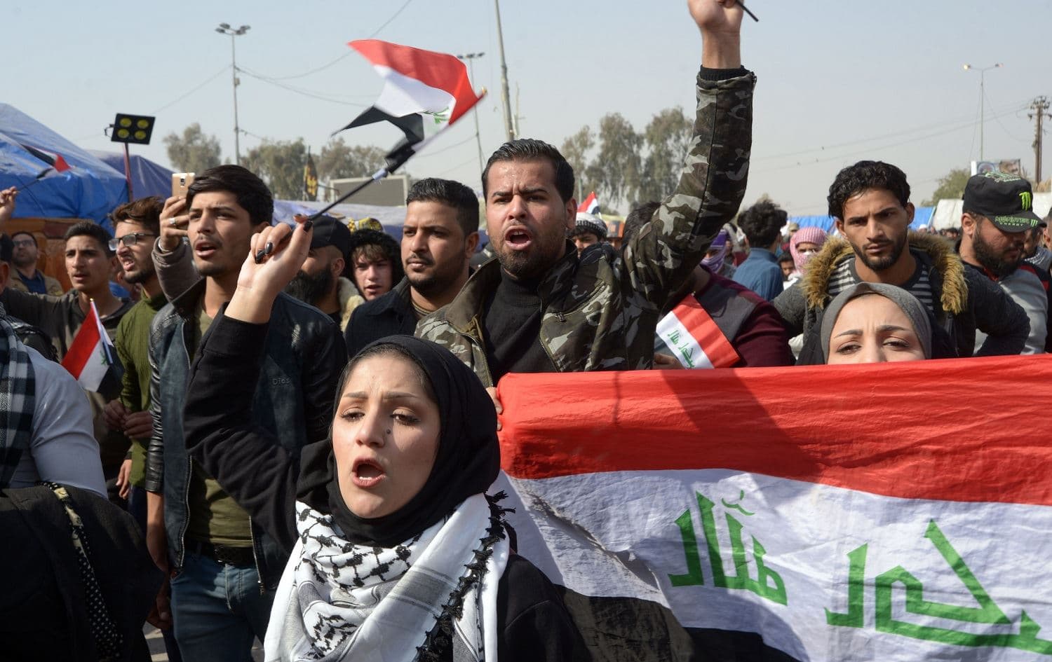 Iraqi anti-government demonstrators chant as they rally in the central city of Najaf on February 6, 2020. Photo: Haidar Hamdani / AFP