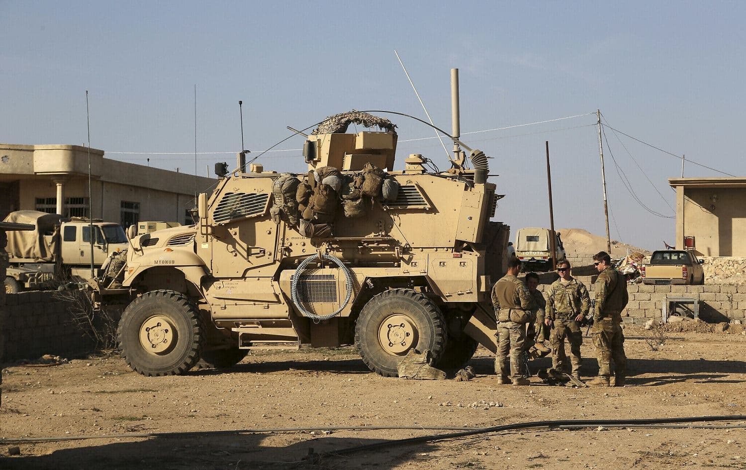US Army soldiers stand outside their armoured vehicle on a joint base with the Iraqi Army south of Mosul, Iraq, February 23, 2017. File photo: Khalid Mohammed / AP