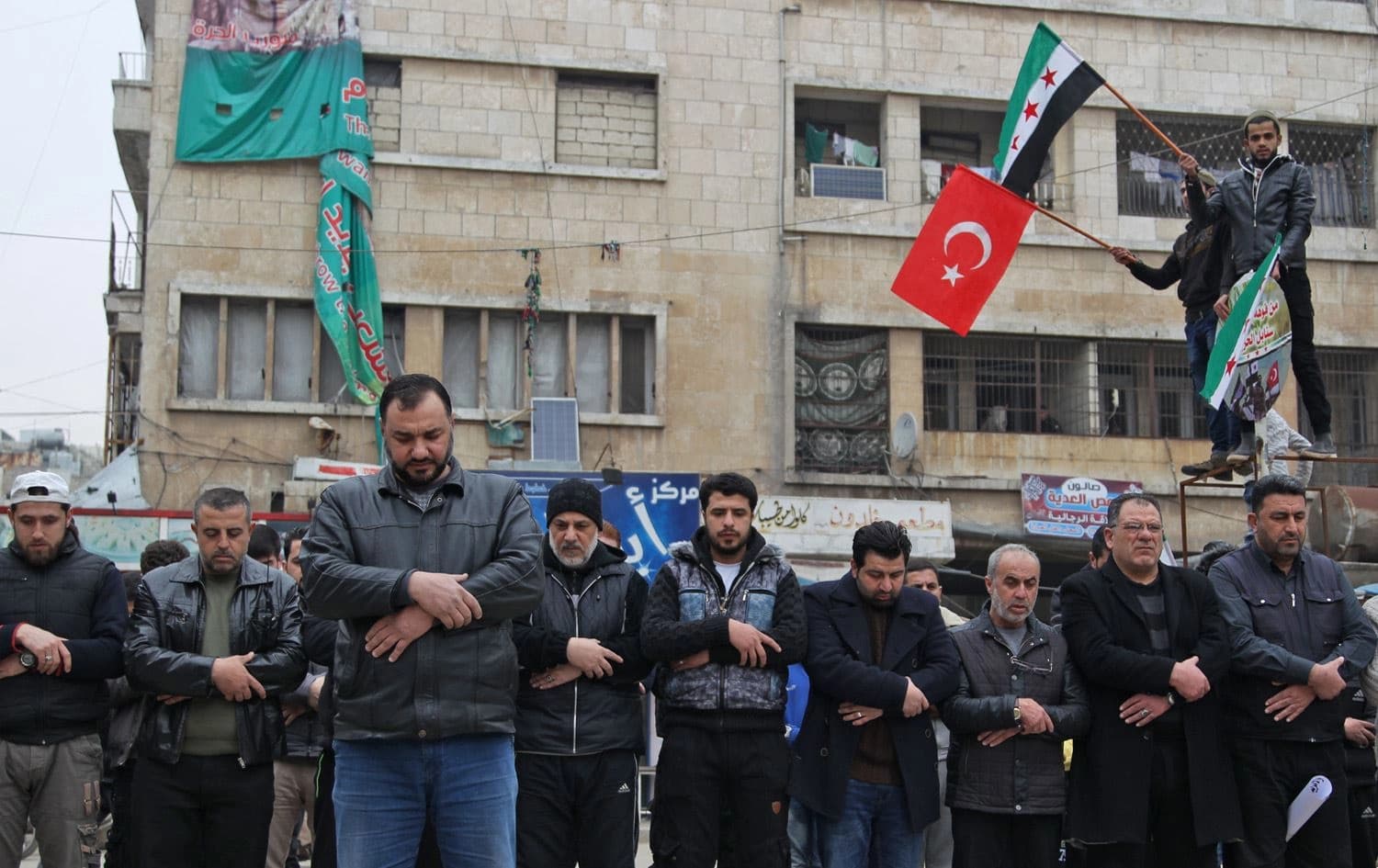 Syrians in the northwestern city of Idlib perform funerary prayers on February 28, 2020 for Turkish soldiers killed the previous day in a Syrian government air strike. Photo via Abdulaziz Ketaz / AFP