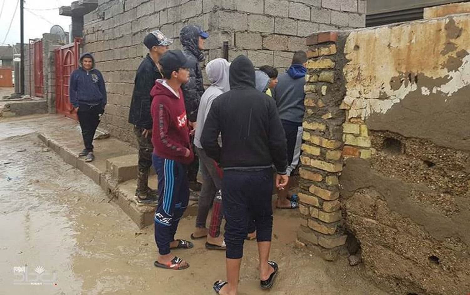 Observers gather by the victims' house. Photo: social media