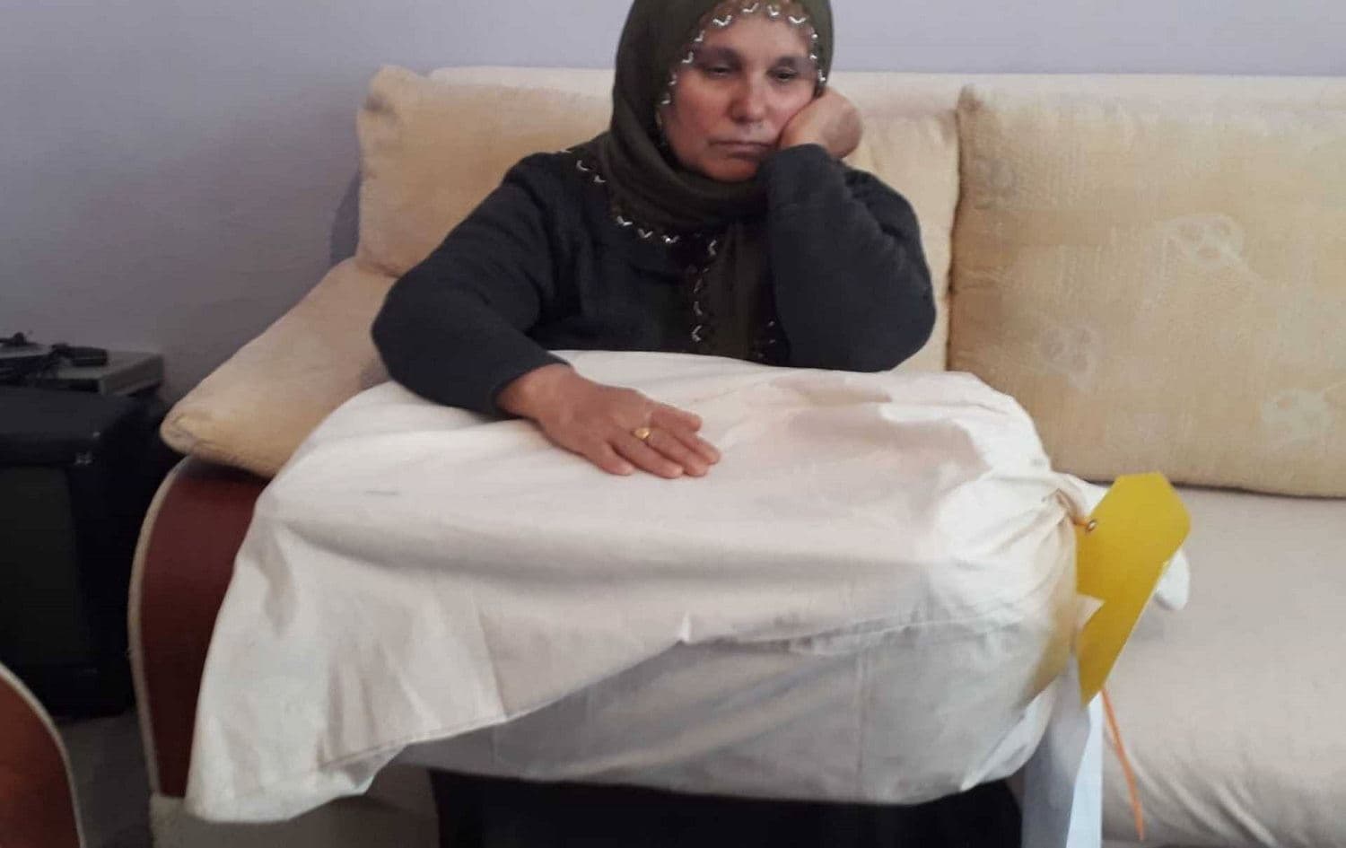Halise Askoy with the remains of her son, who was killed in May 2017. Photo: Evresel News