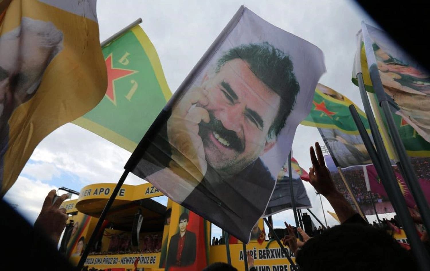 Cheering supporters hold posters of the imprisoned Kurdish rebel leader Abdullah Ocalan in southeastern Turkey. Photo: Associated Press