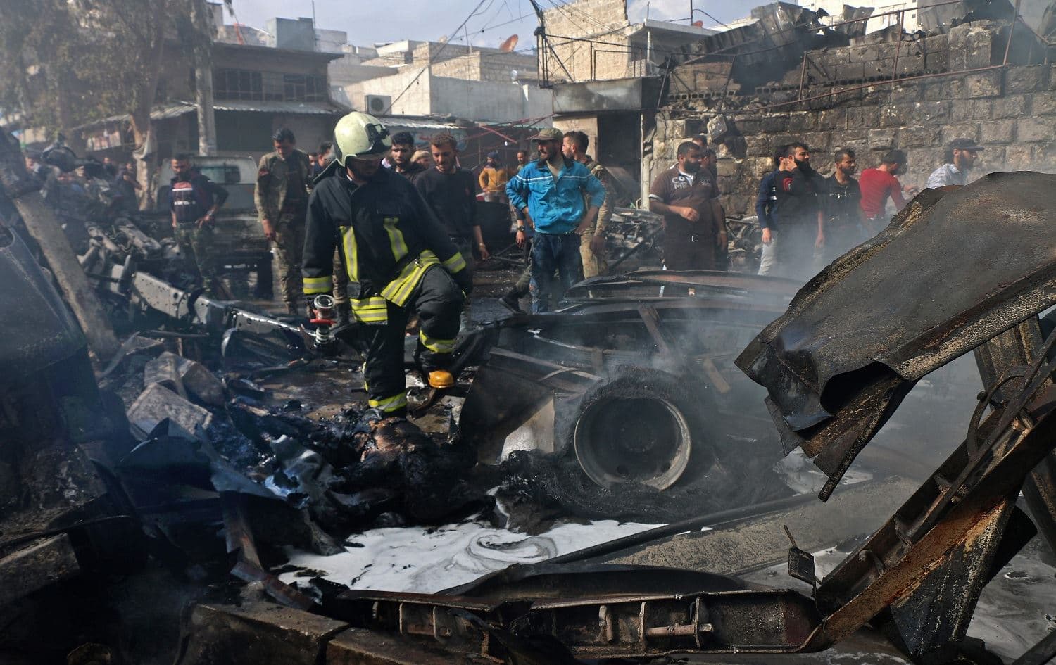 A handout picture released by the Syrian Civil Defence rescue workers shows the scene of the truck bombing in Afrin on April 28, 2020. Photo: AFP/HO/Syrian Civil Defence